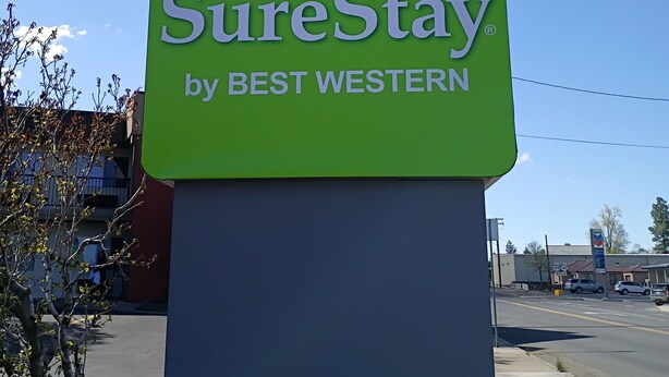 A SureStay by Best Western sign with a recycling symbol. - SureStay by Best Western Lakeview (Lakeview)