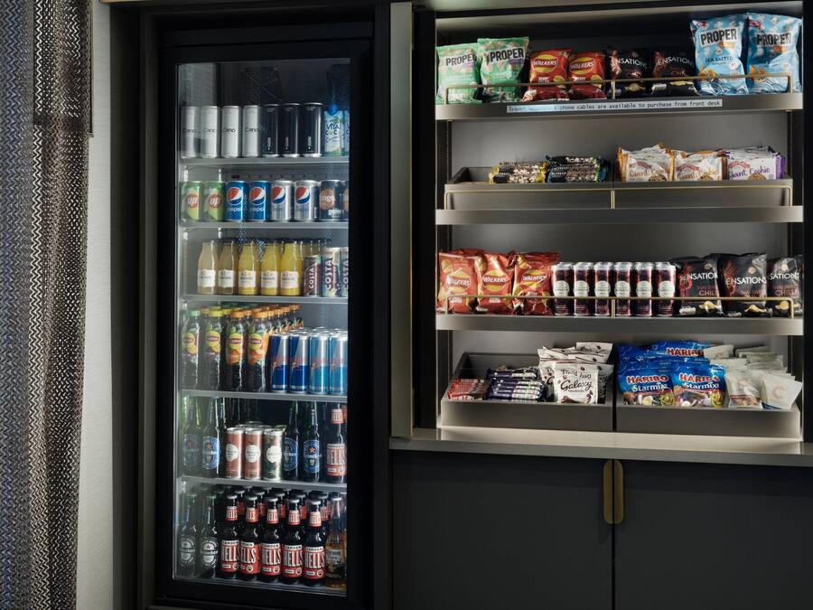 A vending machine stocked with beverages and snacks.