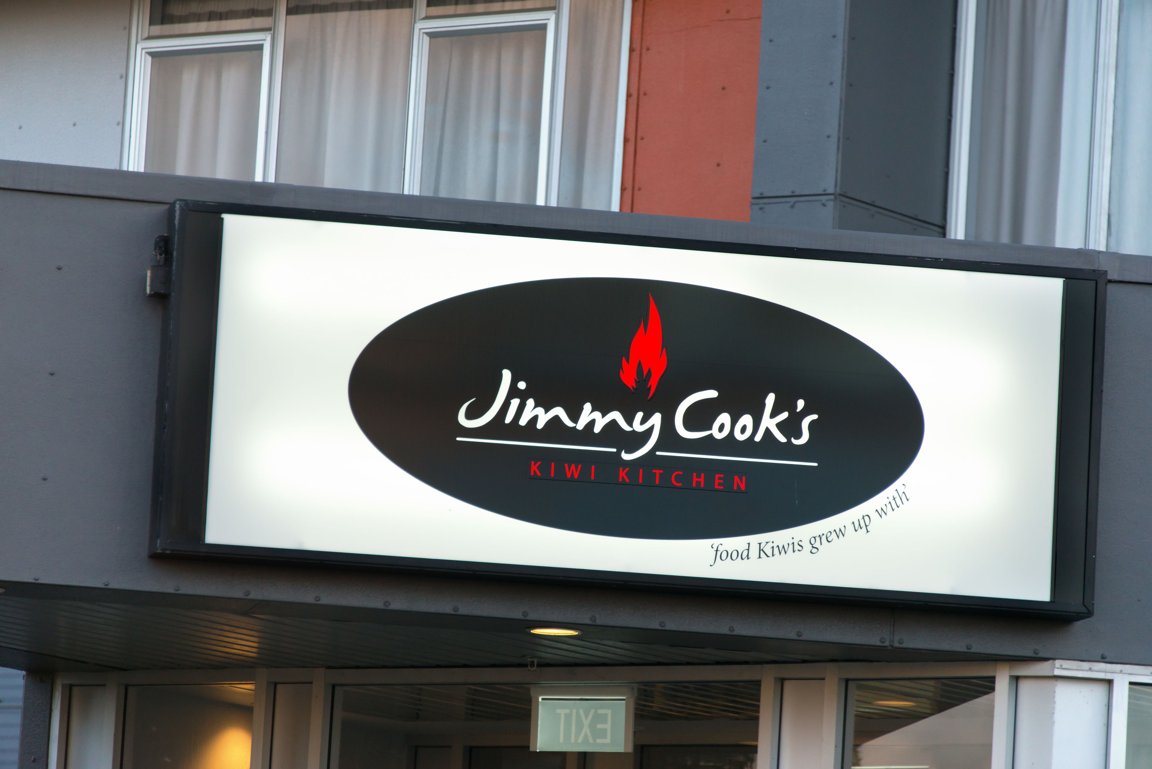 A restaurant signboard for Jimmy Cook's Kiwi Kitchen.