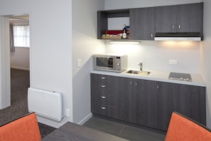 Family Room | Private kitchen | Fridge, electric kettle, eco-friendly cleaning products