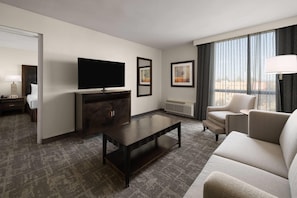 Deluxe Suite, 1 King Bed, Non Smoking | Desk, laptop workspace, blackout drapes, iron/ironing board