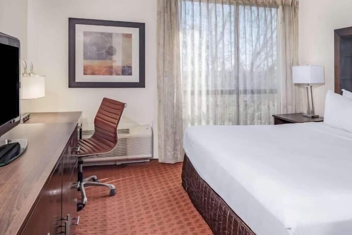 Desk, laptop workspace, blackout curtains, iron/ironing board