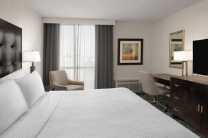 Deluxe Suite, 1 King Bed, Non Smoking | Desk, laptop workspace, blackout drapes, iron/ironing board