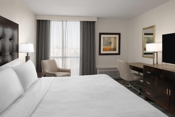 Deluxe Suite, 1 King Bed, Non Smoking | Desk, laptop workspace, blackout drapes, iron/ironing board