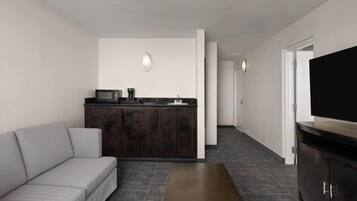 Deluxe Suite, 1 King Bed, Non Smoking | Desk, laptop workspace, blackout drapes, iron/ironing board