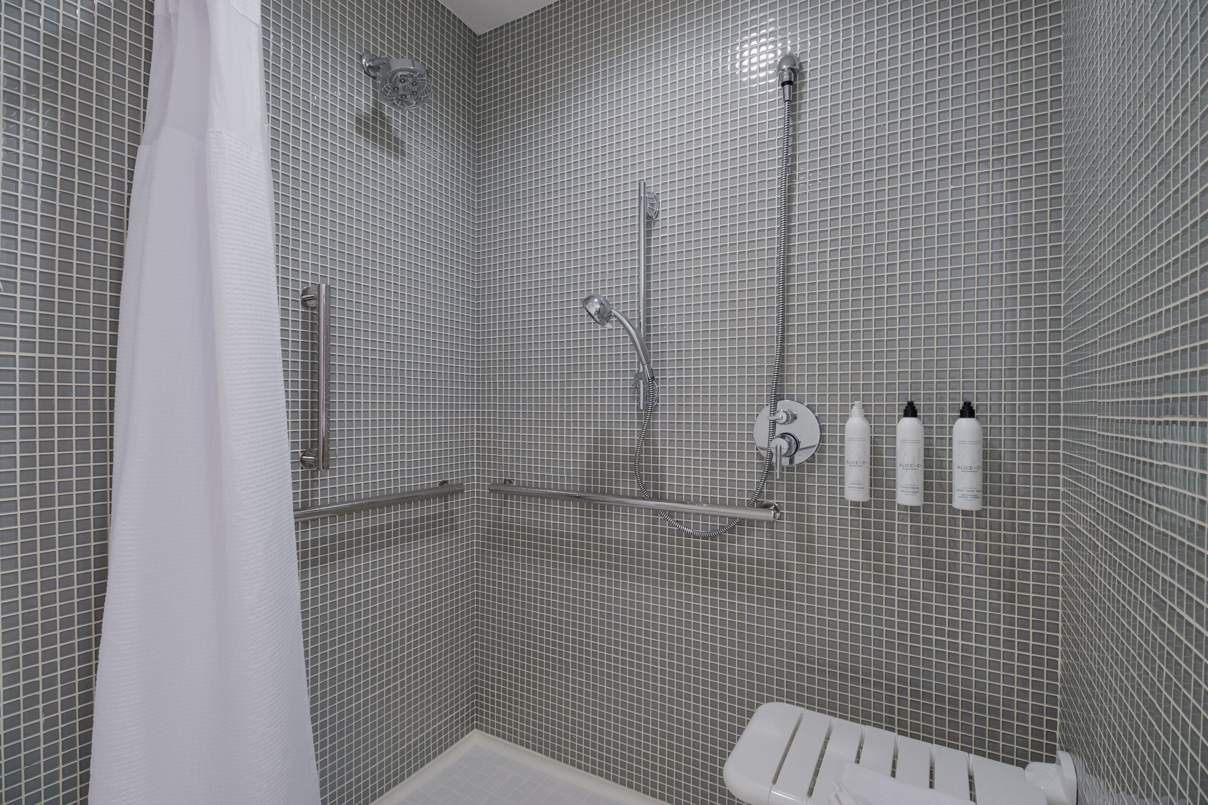 suite, 1 king bed with sofa bed | bathroom | combined shower/bathtub, eco-friendly toiletries, hair dryer, towels