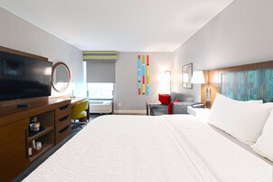 Premium bedding, desk, laptop workspace, blackout drapes