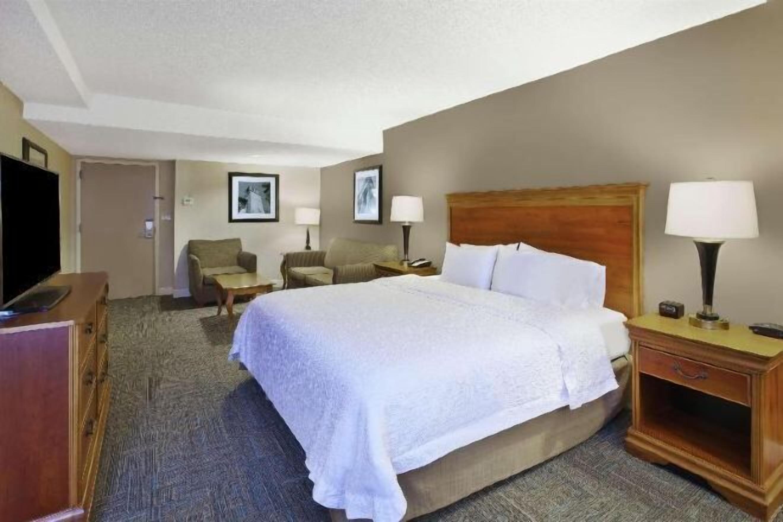 Premium bedding, desk, laptop workspace, blackout curtains