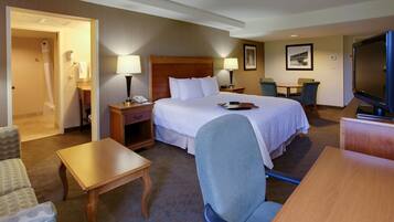 Premium bedding, desk, laptop workspace, blackout drapes