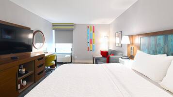 Premium bedding, desk, laptop workspace, blackout curtains