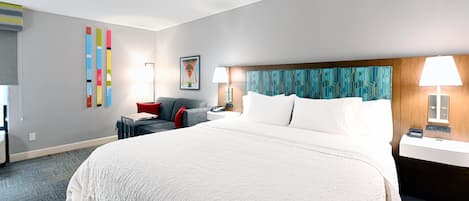 Premium bedding, desk, laptop workspace, blackout drapes