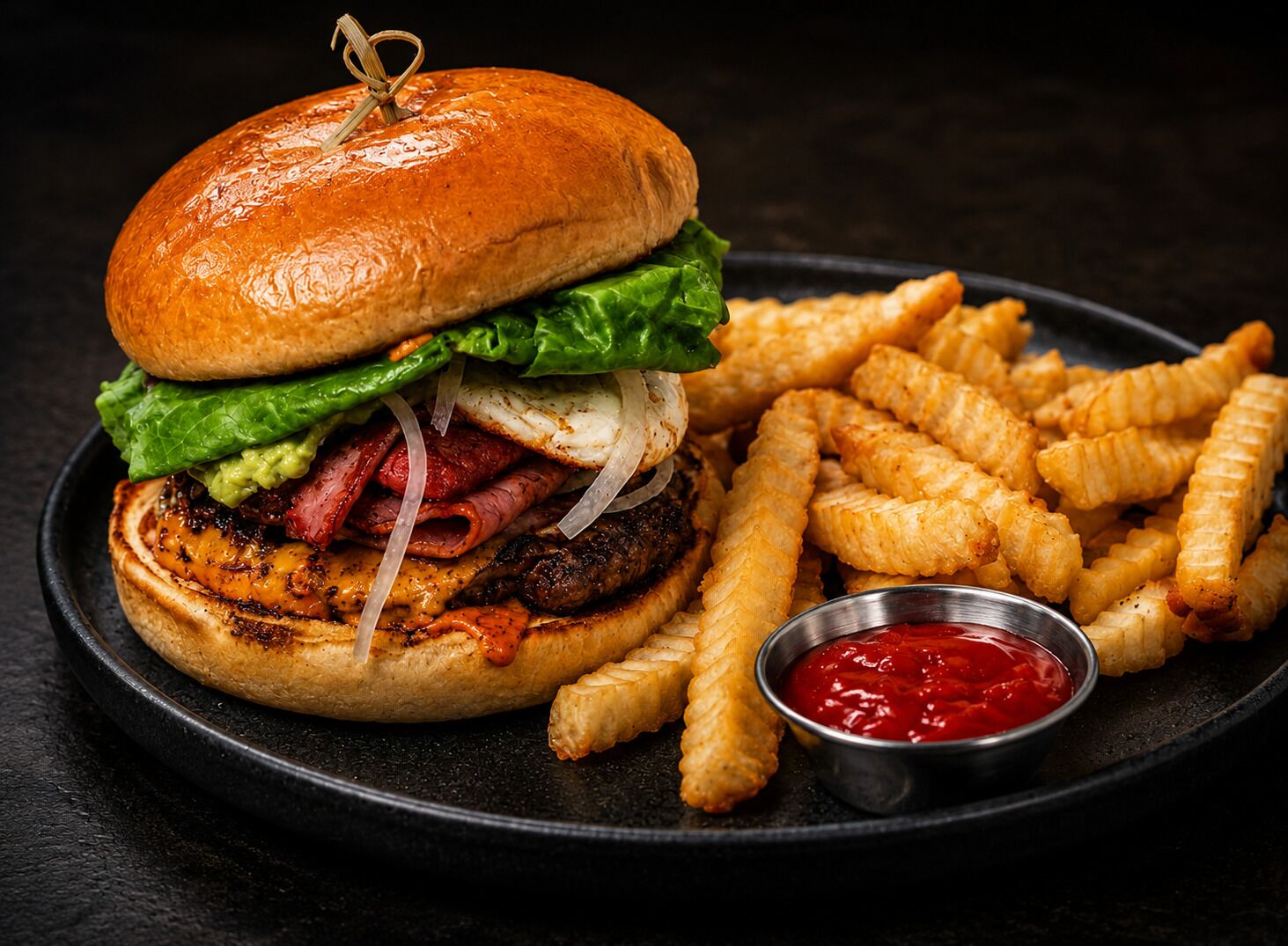 A burger with lettuce, onions, and a bun, accompanied by fries and ketchup.