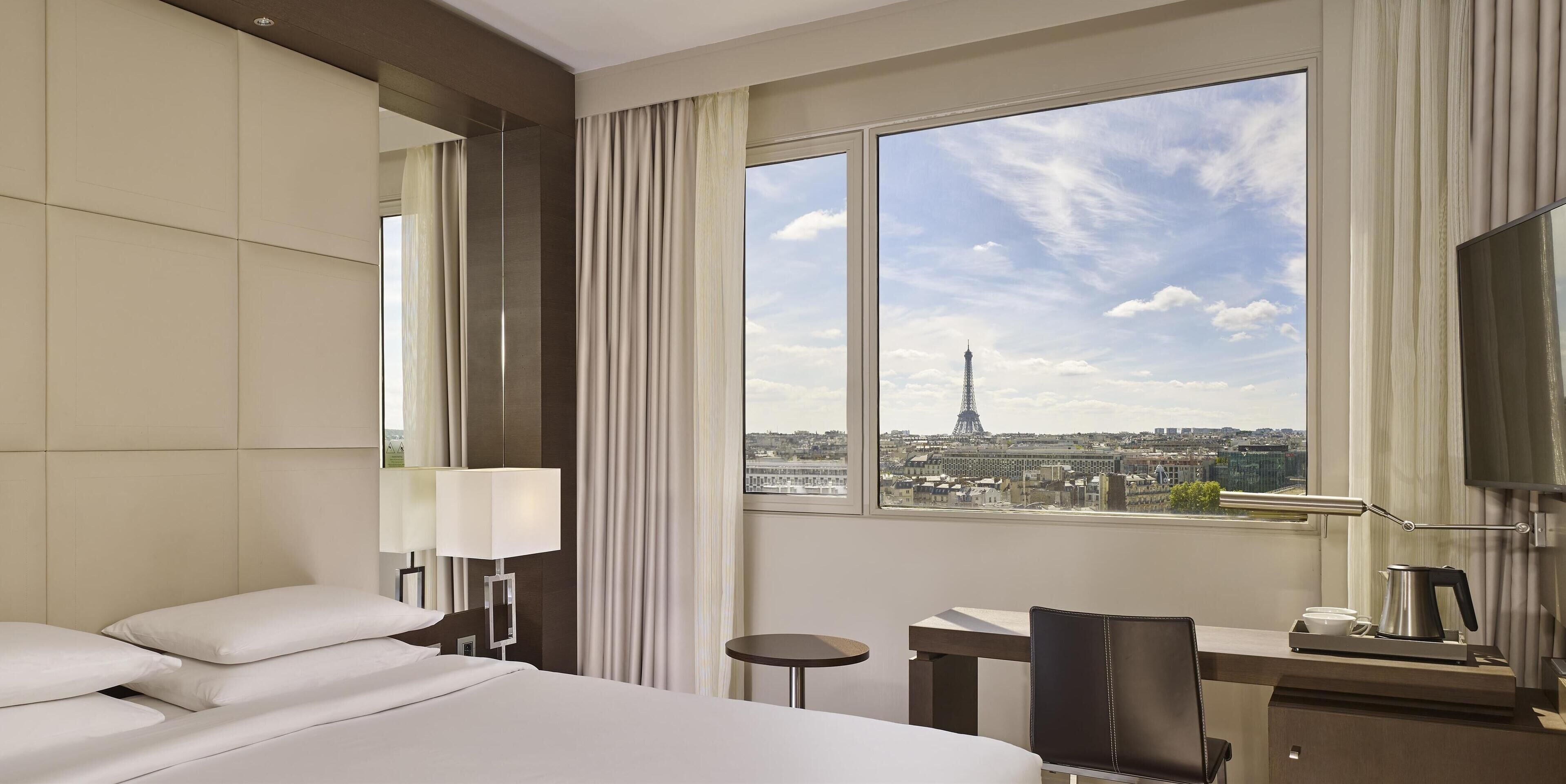 1 king bed with eiffel tower view | premium bedding, in-room safe, desk, blackout curtains