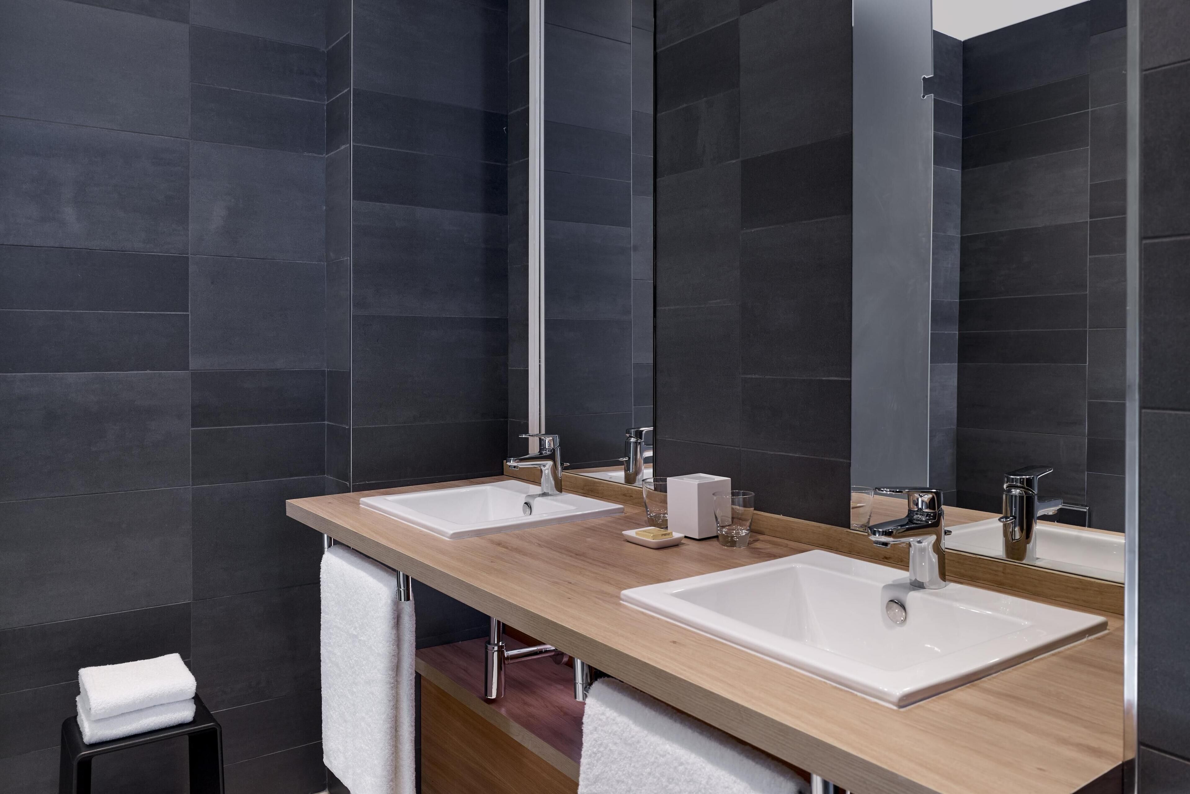 loft suite | bathroom | hair dryer, towels, soap, shampoo