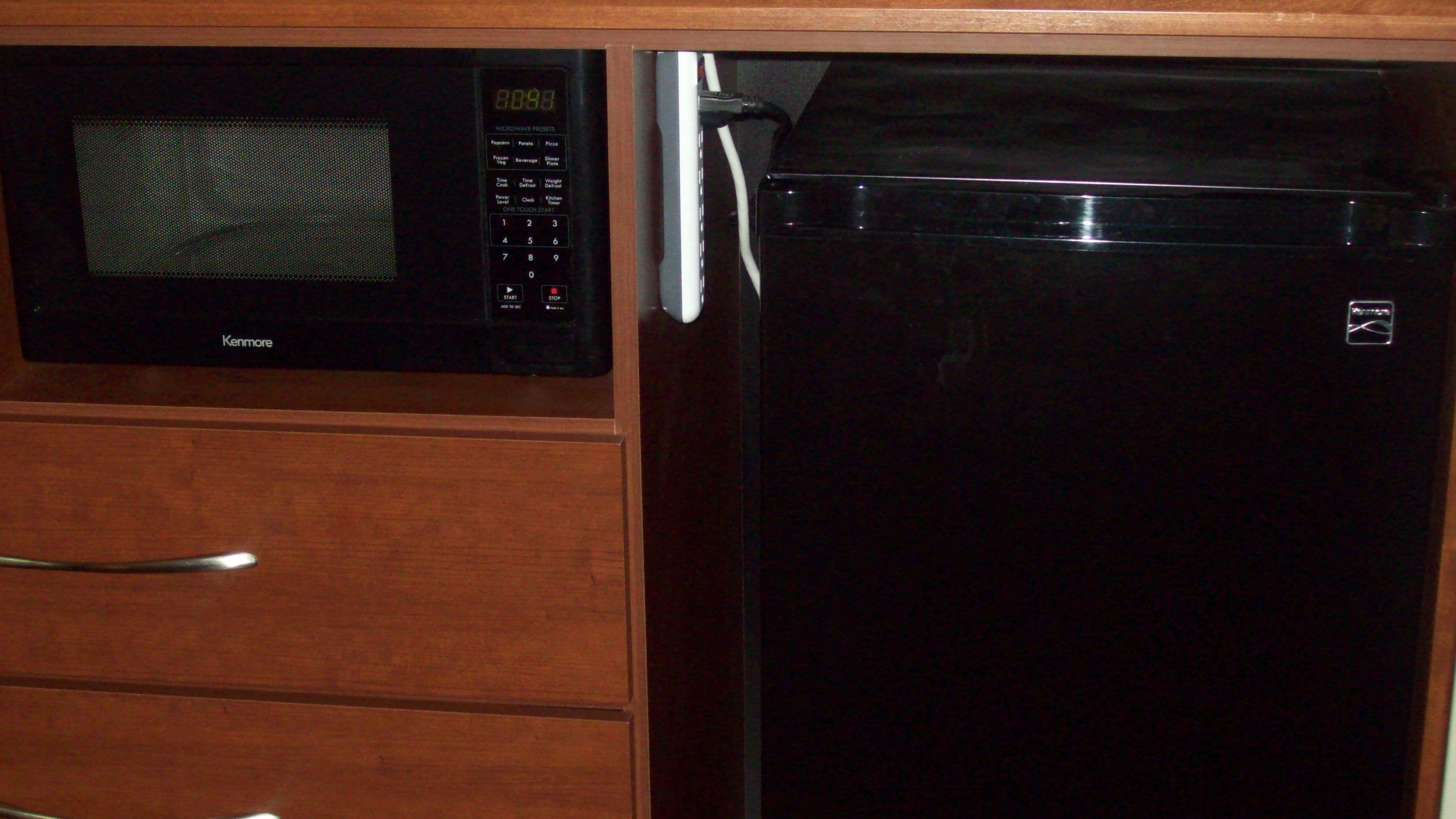 deluxe studio suite, 1 king bed, non smoking, lake view | desk, laptop workspace, blackout curtains, iron/ironing board