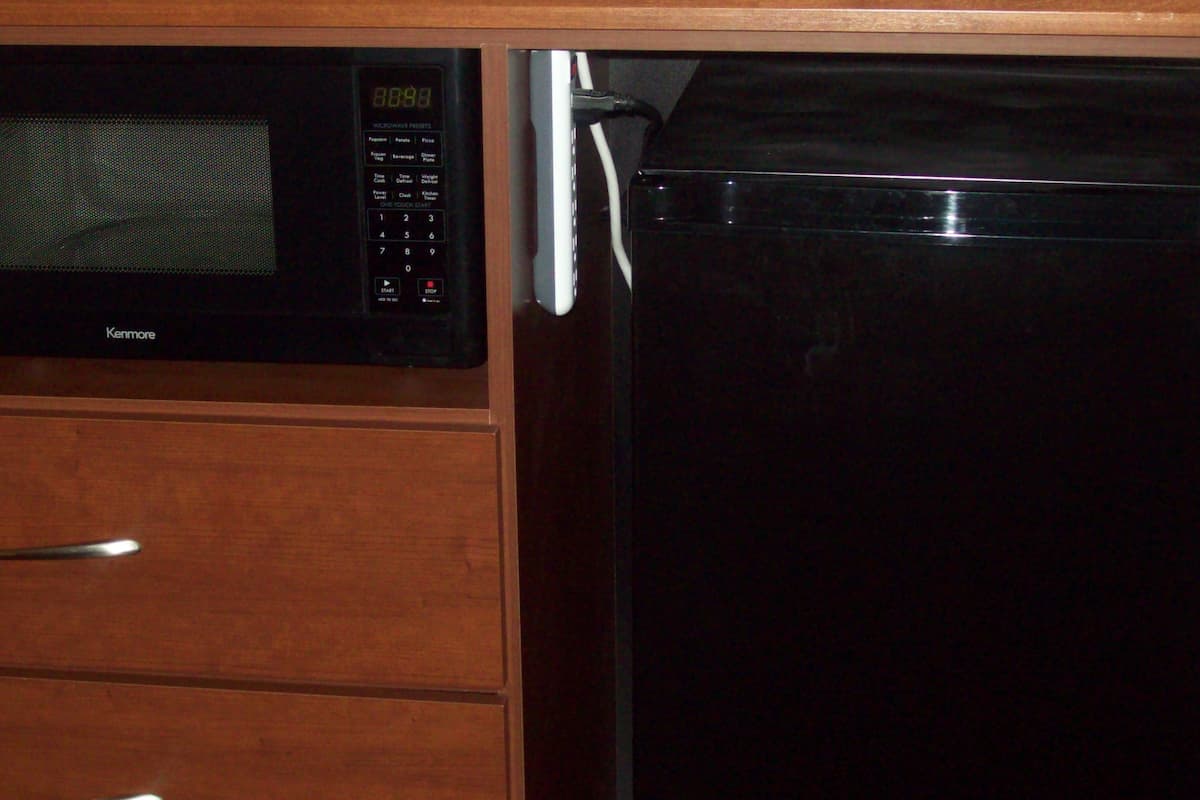 deluxe studio suite, 1 king bed, non smoking, lake view | desk, laptop workspace, blackout curtains, iron/ironing board