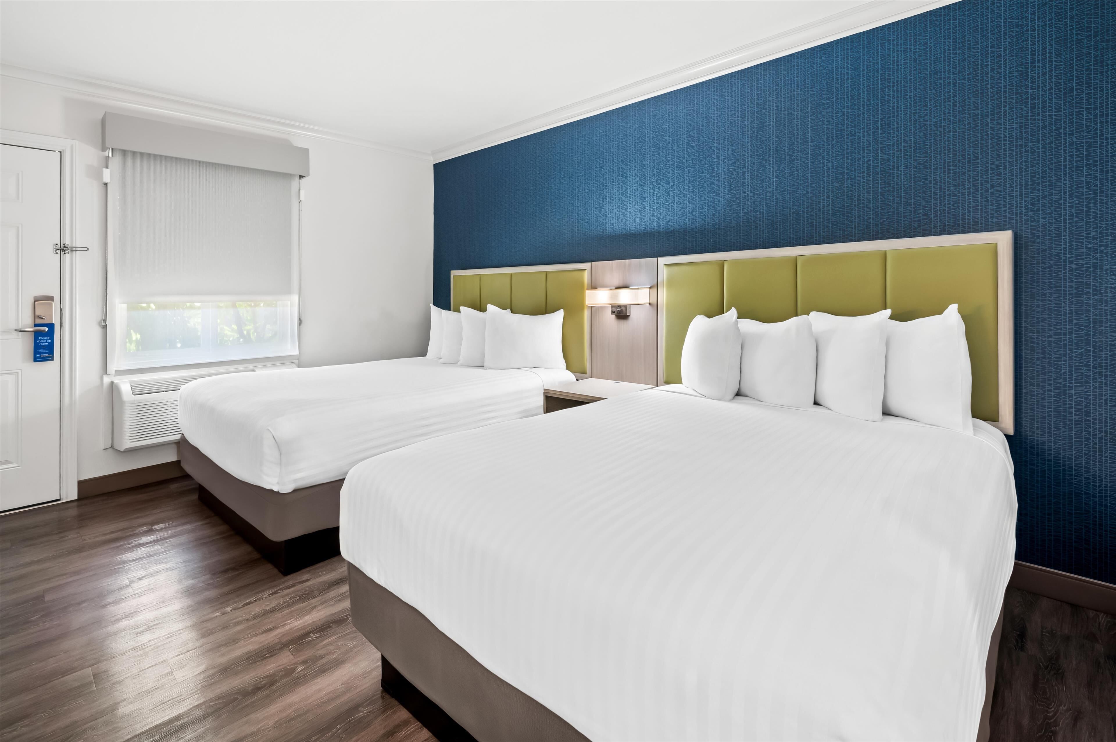 standard room, 2 queen beds, refrigerator & microwave, courtyard area | 1 bedroom, pillow-top beds, desk, laptop workspace