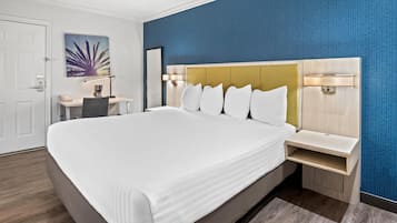 Suite, 1 King Bed, Jetted Tub, Courtyard Area | Pillowtop beds, desk, laptop workspace, blackout drapes