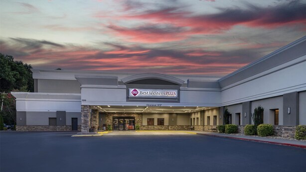 A Best Western PLUS hotel with a clear sky and a sunset.