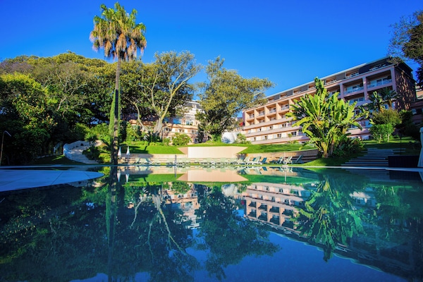 Indoor pool, seasonal outdoor pool, pool umbrellas, sun loungers