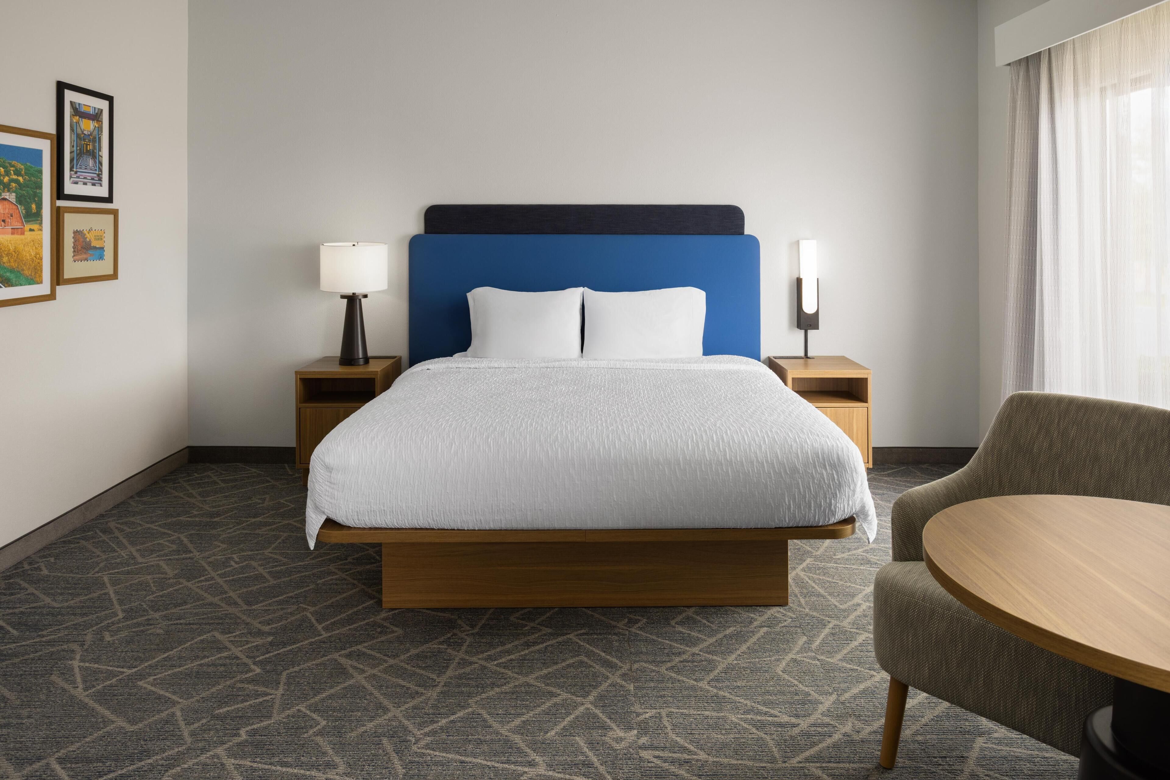 Down comforters, desk, blackout drapes, iron/ironing board