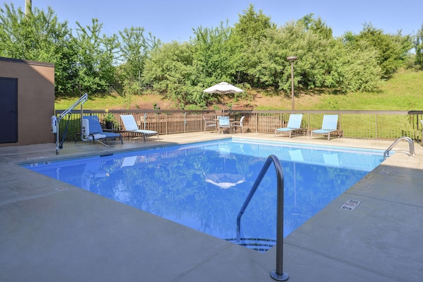 Seasonal outdoor pool, open 8:00 AM to 10:00 PM, pool umbrellas