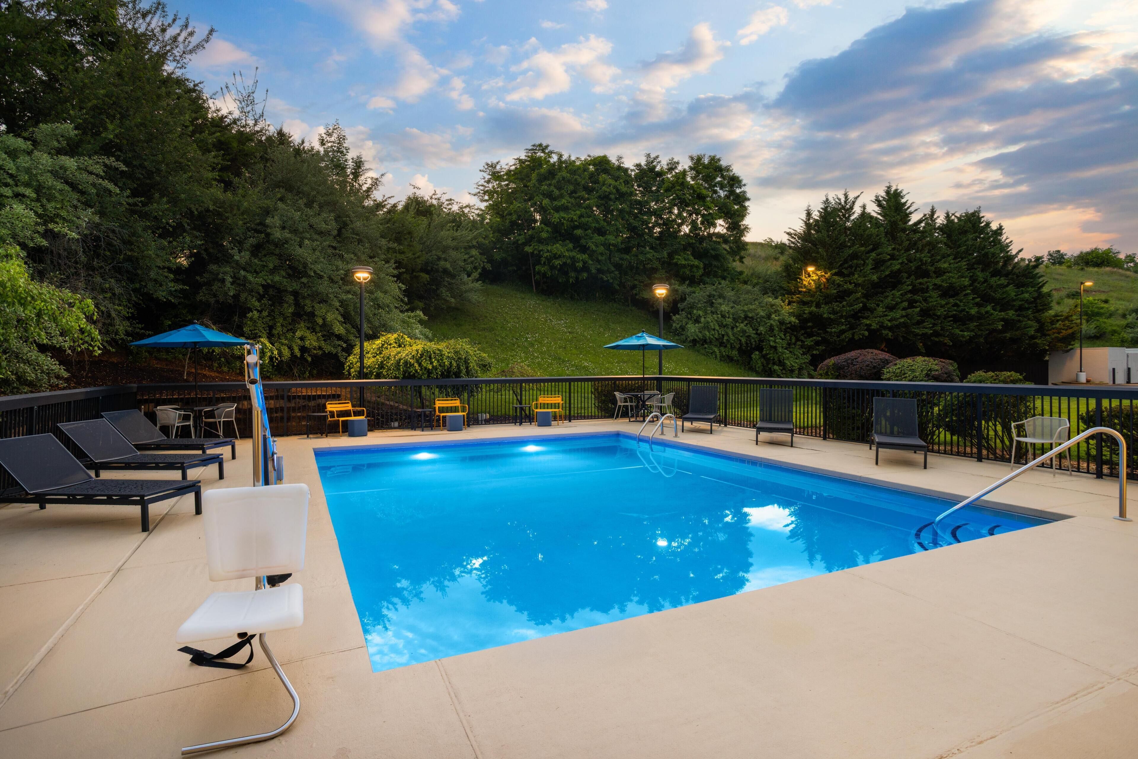 Seasonal outdoor pool, open 8:00 AM to 10:00 PM, pool umbrellas