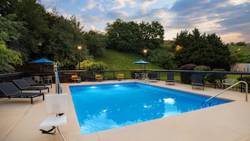 Seasonal outdoor pool, open 8:00 AM to 10:00 PM, pool umbrellas