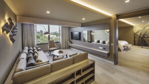 A modern living room with a sofa, coffee table, and TV.