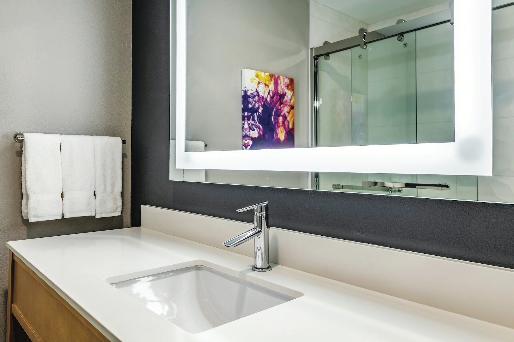 combined shower/bathtub, designer toiletries, hair dryer, towels