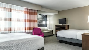 A hotel room with two beds, a TV, a desk, a chair, and a large window with curtains. - La Quinta Inn & Suites by Wyndham Seattle Federal Way (Federal Way)