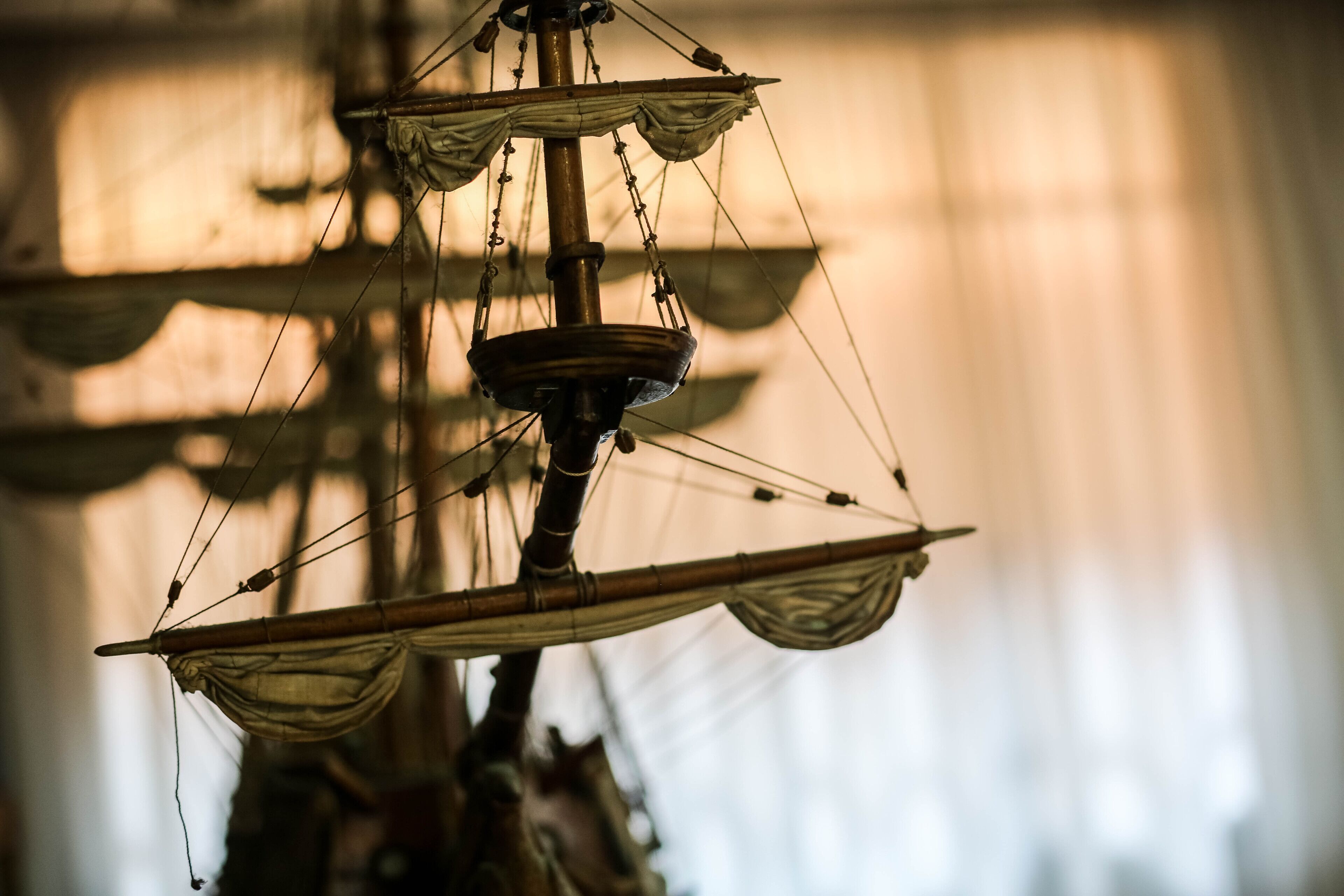 A close-up of a ship's rigging and sails.