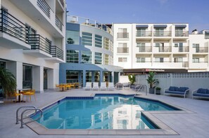 Outdoor pool, open 7:00 AM to 10:00 PM, sun loungers