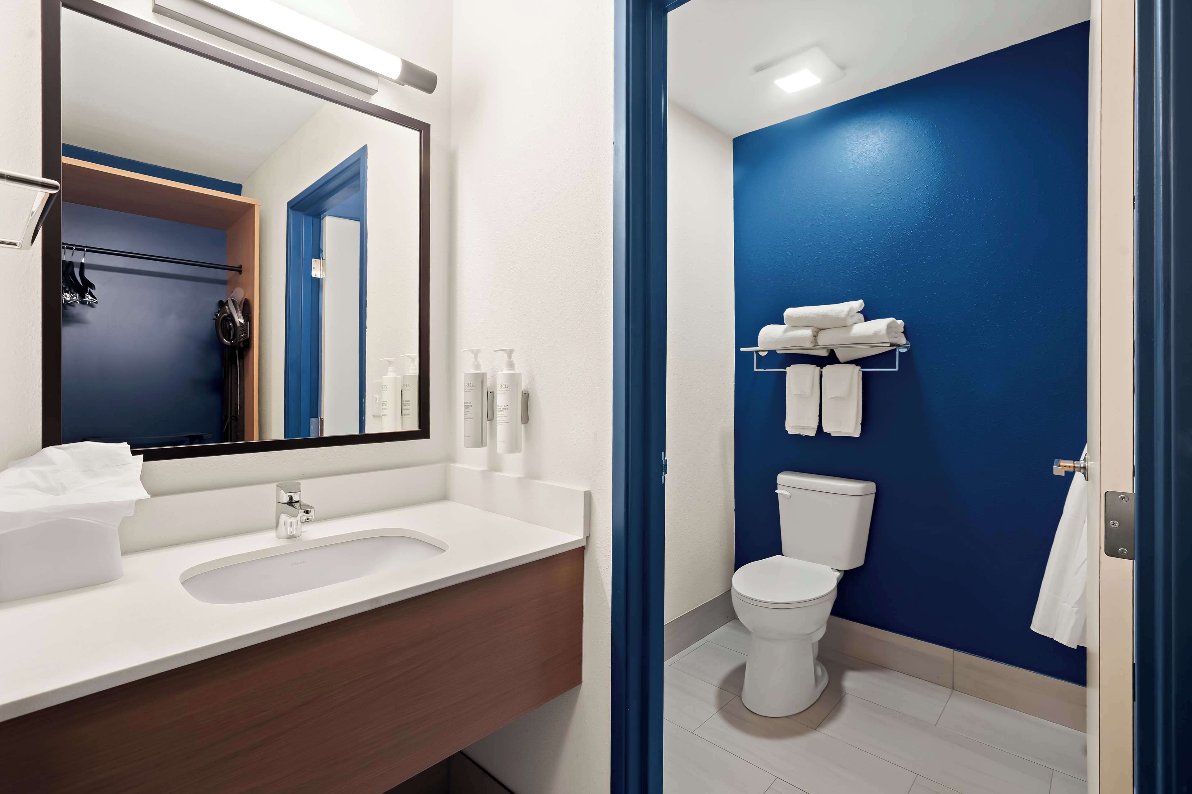 eco-friendly toiletries, hair dryer, towels