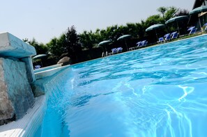 Indoor pool, outdoor pool, pool umbrellas, sun loungers