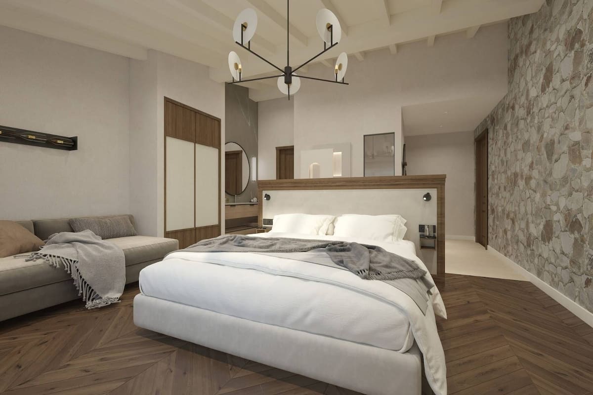 Une chambre moderne avec un grand lit, un canapé et un luminaire au plafond original.