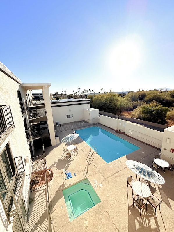 Outdoor pool, open 6 AM to 10 PM, pool loungers