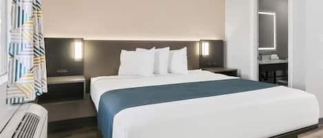 Desk, laptop workspace, blackout drapes, iron/ironing board