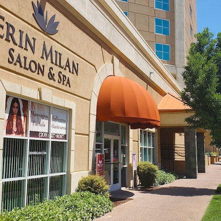 A building with a sign for 'Erin Milan Salon & Spa'.