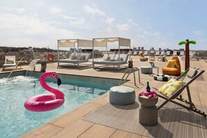 Seasonal outdoor pool, open 11:00 AM to 7:00 PM, pool loungers