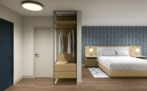A modern bedroom with a bed, bedside tables, a wardrobe, and a mirror.