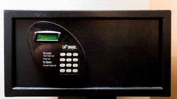 A black electronic keypad with a digital display, instructions for locking and unlocking, and a brand name 'SAFEMARK SYSTEMS'.