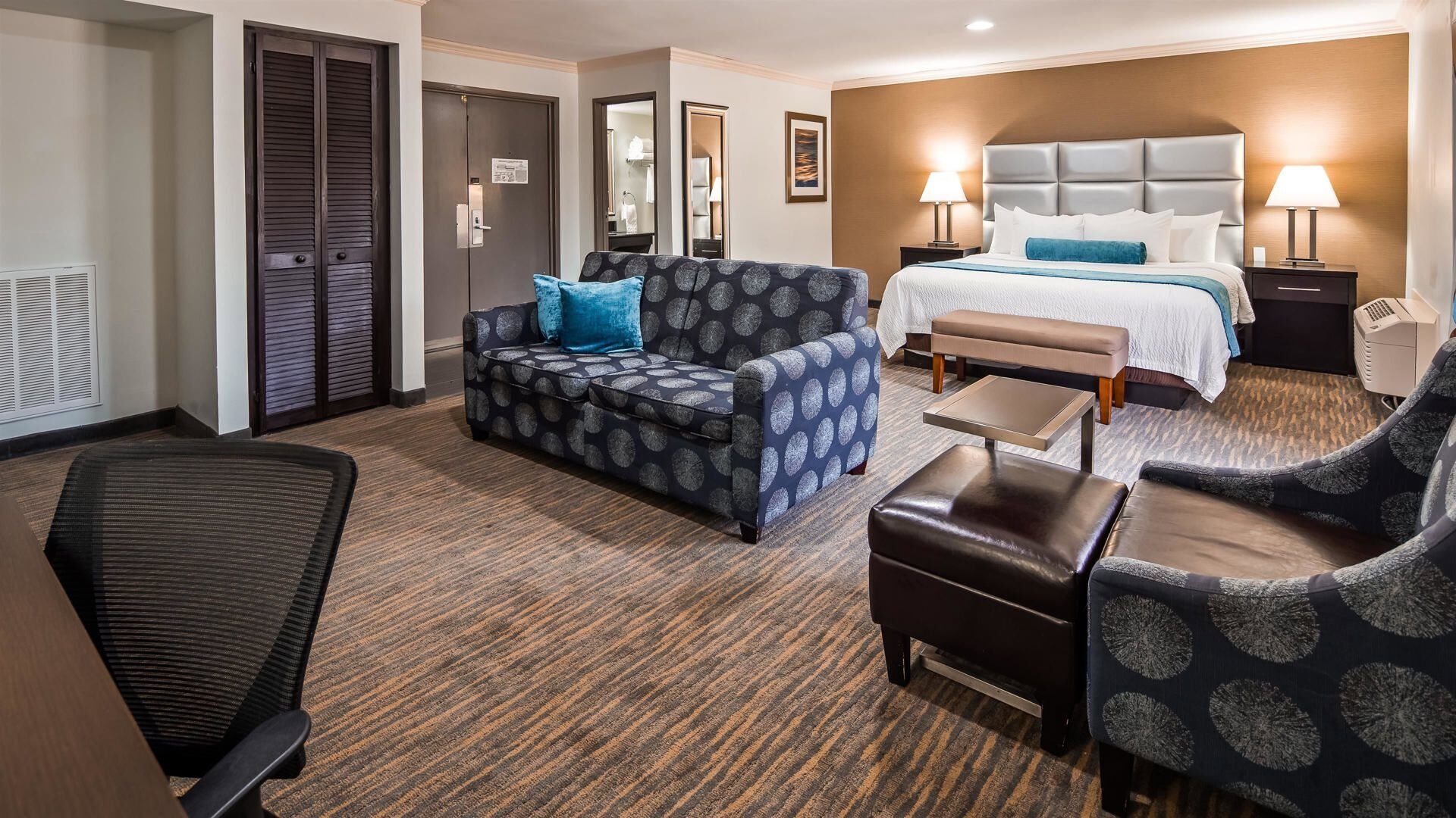 Premium bedding, desk, laptop workspace, blackout curtains