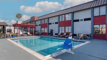 Seasonal outdoor pool, pool umbrellas, pool loungers