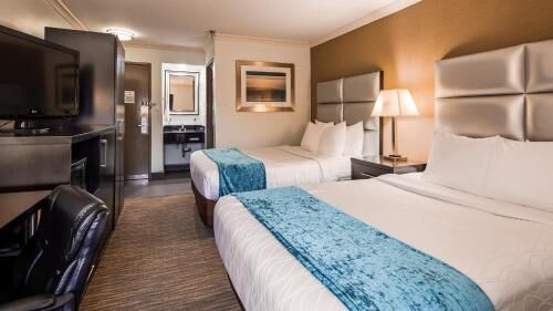 Premium bedding, desk, laptop workspace, blackout curtains