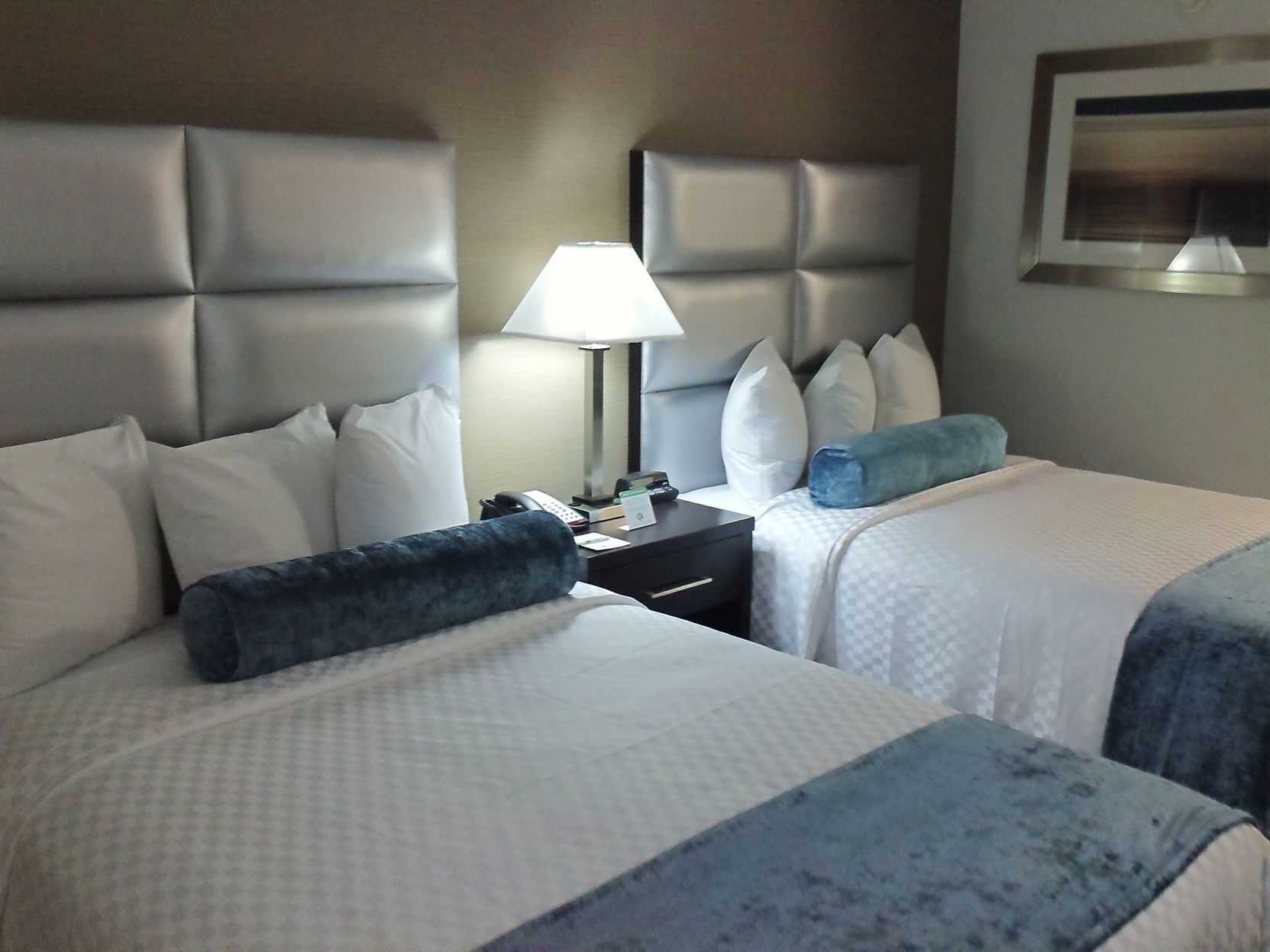 Premium bedding, desk, laptop workspace, blackout drapes