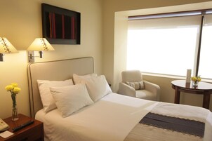 Premium bedding, down comforters, pillowtop beds, minibar