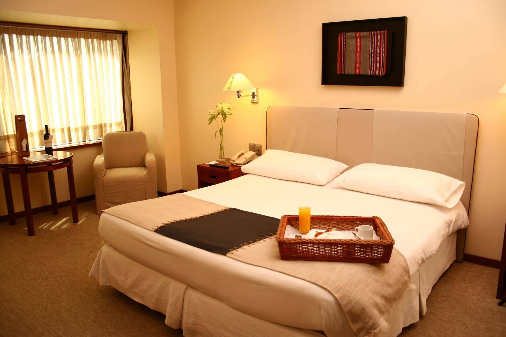 Luxe beddengoed, donzen dekbedden, pillowtop-bedden, een minibar