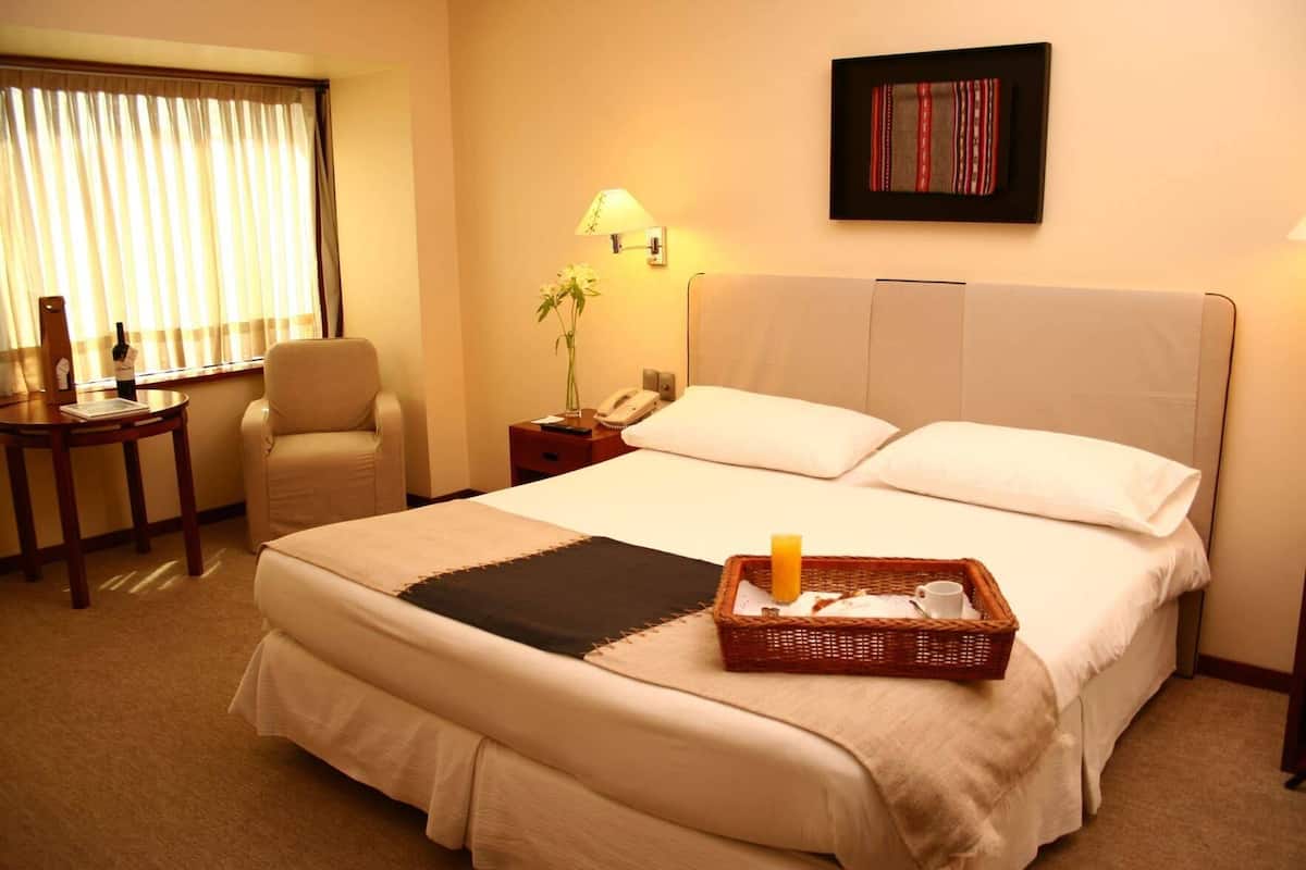 Premium bedding, down comforters, pillowtop beds, minibar