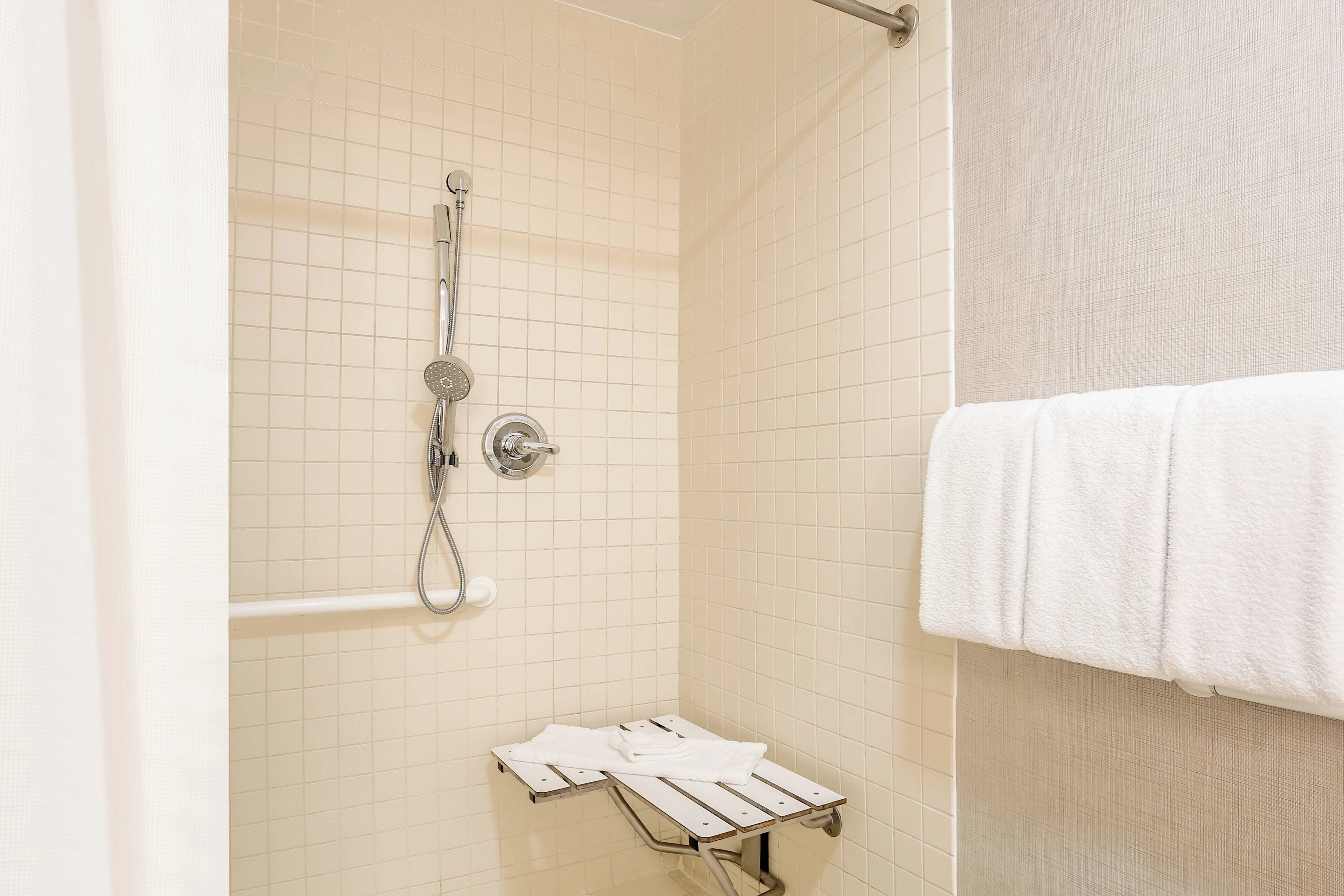 combined shower/bathtub, hair dryer, towels, soap